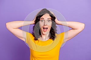 Photo of young woman arms touch head amazed shocked fake news stupor isolated over violet color background