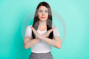 Photo of young woman crossed hands show no stop sign forbidden reject isolated over teal color background