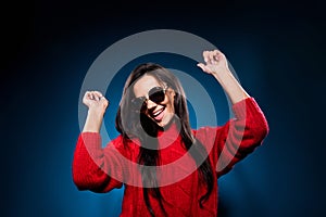 Photo of young woman happy positive smile have fun enjoy music dance party isolated over dark blue color background