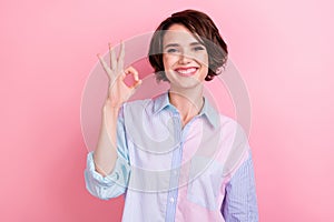 Photo of young woman happy positive smile show okey sign deal done decision promo isolated over pink color background