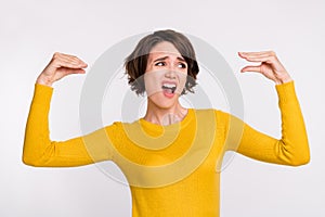 Photo of young woman irritated show hands speak talk dialog blah bla mocking isolated over grey color background