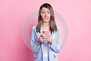 Photo of young woman nervous panic fail mistake dislike use smartphone  over pastel color background
