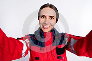 Photo of young woman paramedic happy positive smile make selfie first help isolated over white color background