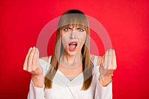 Photo of young woman unhappy negative angry mad accuse blame fail trouble isolated over red color background