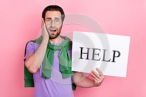 Photo of young worried negative mood unemployed man looking for job bankrupt isolated on pink color background