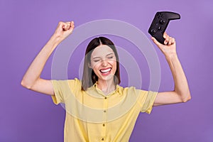 Photo of youth excited lady hooray champion winner race video game station isolated over violet color background