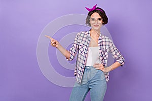 Photo of youth lovely girl indicate finger empty space proposition direct suggest isolated over violet color background