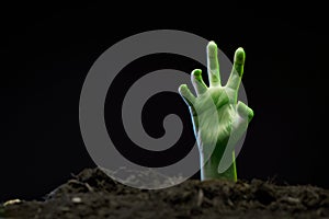 Photo of zombie hand sticking out of grave.