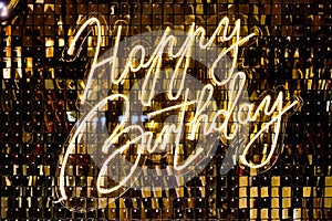 Photo zone with golden sparkles, balloons and the inscription Happy Birthday