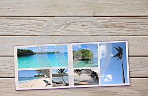 Photobook Album on Deck Table with Travel Photos