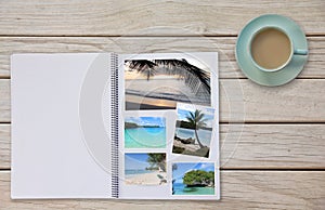 Photobook Album on Deck Table with Travel Photos Coffee or Tea in Cup