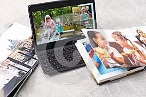 photobook album and tablet on the table