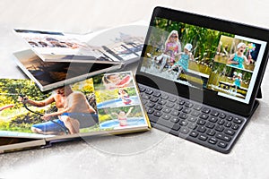 photobook album and tablet on the table