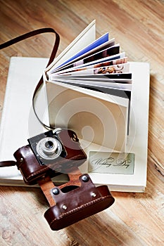 Photobook with a cover of leatherette and the old camera