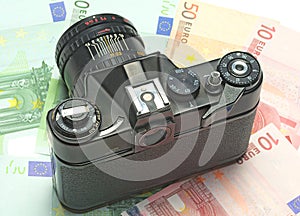 Photocamera lying on the euros