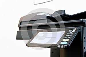 The photocopier or network printer is office worker tool equipment for scanning and copy paper