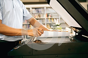 Photocopier printer, Close up hand office man place the sheet on panel to using the copier or photocopy machine for scanning