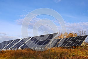 Photoelectric batteries on the background of a blue sky with clouds photo