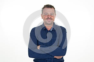 Photogenic middle aged man folded arms crossed on white background