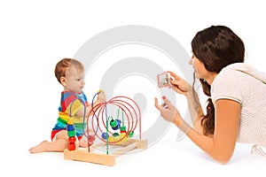 Photograph baby playing
