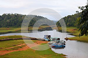 Boats in Periyar Lake and National Park, Thekkady, Kerala, India photo