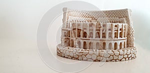 Photograph of coloseum the amphitheatre rome in minitatire version with white background and space for text Rome