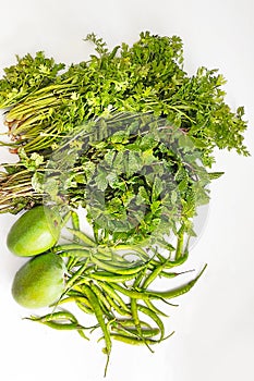 Photograph of Coriander, Mint, Green Chilli And Raw Mango. Raw Material for Indian Home Made Spicy Green Sauce.