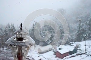 Crystals of Snow over Golden Lamp with Ongoing Snow Fall - Snow Particles in Air photo