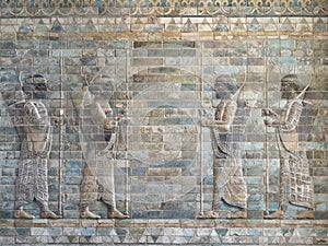 Ancient artistic wall of babylonian soldiers and archers