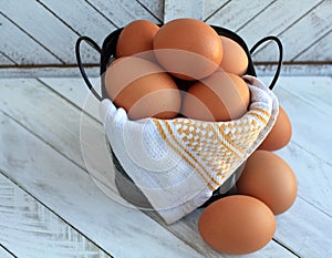 photograph of Eggs close up inside a bucket