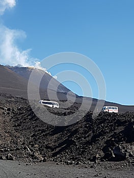 Photograph of the Etna volcano next to Catania in Sicily, taxis bus brings people upstairs