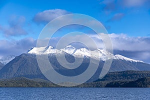 Photograph of a large lake and mountain range while driving from Te Anau to Manapouri in New Zealand