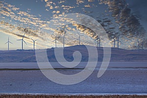 Photograph of Wind Turbines on a hill ridge line around Lake George in Australia