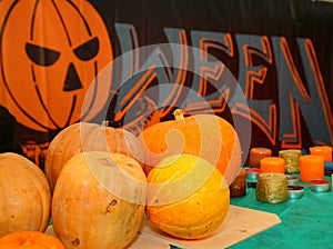 The photograph lying on the table pumpkins and candles to celebrate Halloween