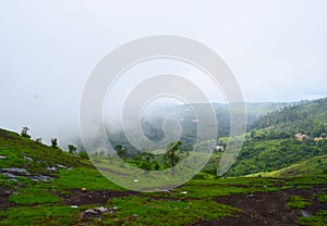 Misty Green Hills in Western Ghats - Peerumedu, Idukki District, Kerala, India - Natural Background photo