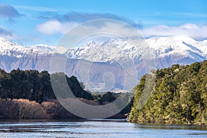 Photograph of mountains and the flooding Waiau River in Manapouri in New Zealand