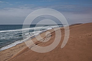 Photograph of the Namibe Desert. Coast line with desert dunes. Africa. Angola. Namibe