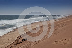 Photograph of the Namibe Desert. Coast line with desert dunes. Africa. Angola. Namibe