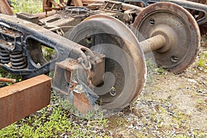 Photograph of old and rusty train carriage bogies