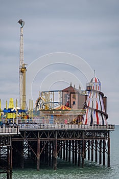 Photograph of Palace Pier, Brighton, East Sussex UK, showing funfair at the far end. photo