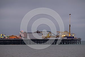 Photograph of Palace Pier, Brighton, Sussex UK, showing funfair at the far end. photo