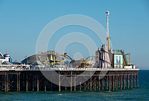 Photograph of Palace Pier on the Brighton UK sea front, showing the rides at the far end of the Pier including the helter skelter. photo