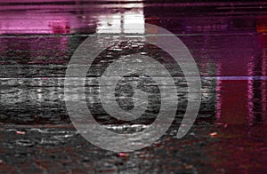 photograph of a paved road during the rain. background