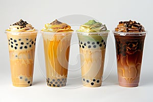 Photograph presenting four boba tea in plastic cups isolated on white background