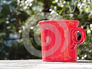 Photograph of Red Coffee Cup Outside