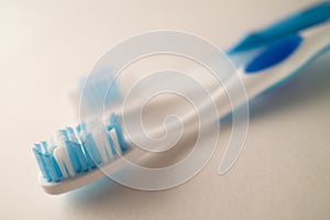 Photograph with Shallow Depth of Field of Toothbrushes on a White Background