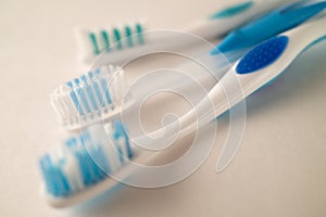 Photograph with Shallow Depth of Field of Toothbrushes on a White Background
