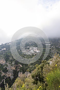 Photograph taken in a city near Sorrento, Italy, offering a view of the urban landscape nestled amidst nature