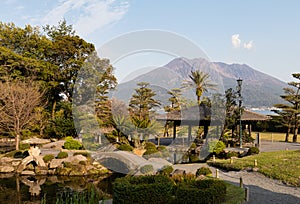 Japanese traditional garden Sengan-en with Sakarakima, an active volcano in Kagoshima, Japan