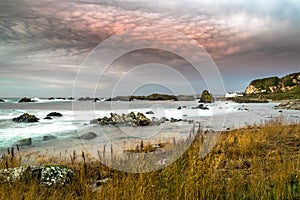 This photographe was taken at sunset on the beach near Ballintoy Harbor